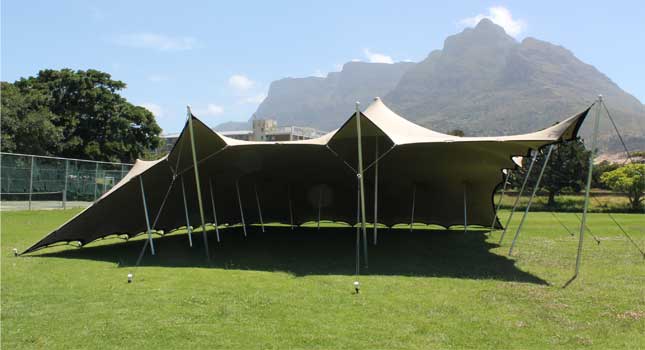 Event riggers securing a stretch tent